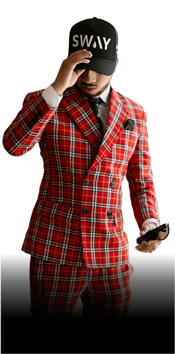 Stanley George in a red plaid suit and SWAY cap